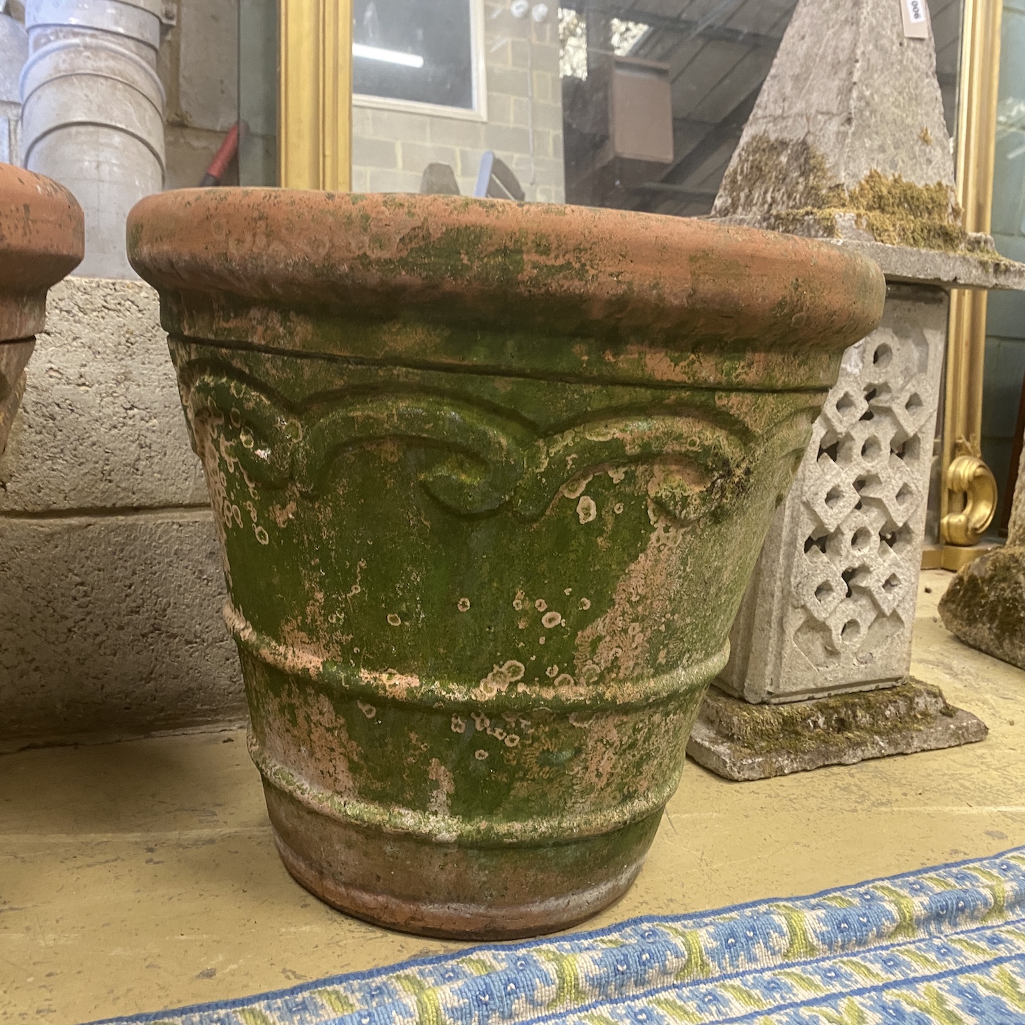 A pair of circular weathered terracotta garden planters, diameter 54cm, height 51cm